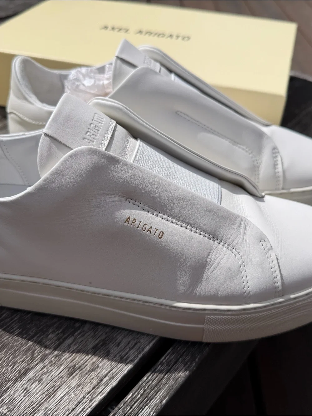 Axel Arigato White Leather Slip-On Sneakers with Gold Logo